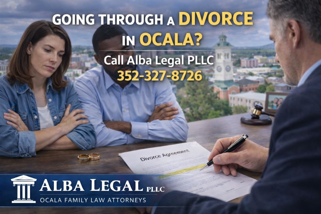 Interracial couple sitting across from a divorce attorney in a Ocala, FL law office, reviewing a highlighted Divorce Agreement document. Wedding rings and a gavel rest on the desk, with bold text reading "Going Through a Divorce in Ocala,FL? Call Alba Legal PLLC 352‑327‑8726" and the Alba Legal PLLC branding displayed prominently.